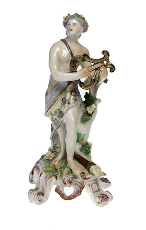 Appraisal: A BOW FIGURE OF APOLLO naked save for a lavender