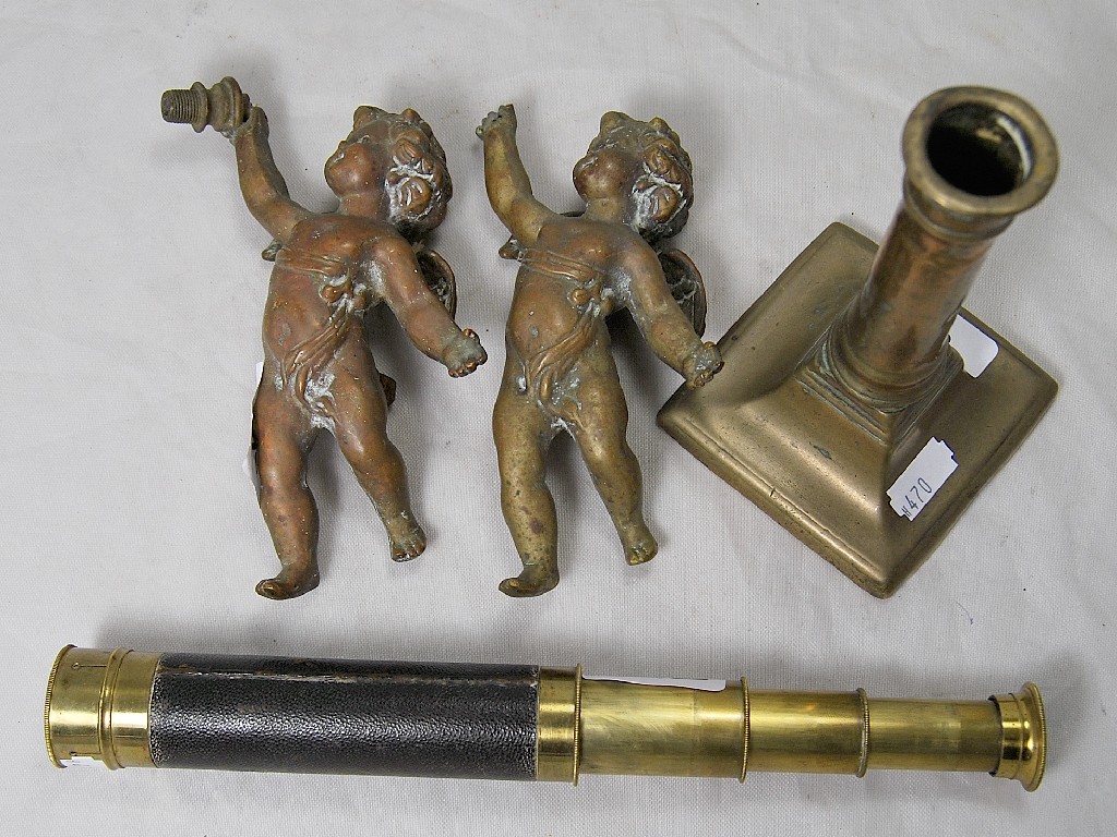 Appraisal: A brass three-drawer pocket telescope an antique brass candlestick and