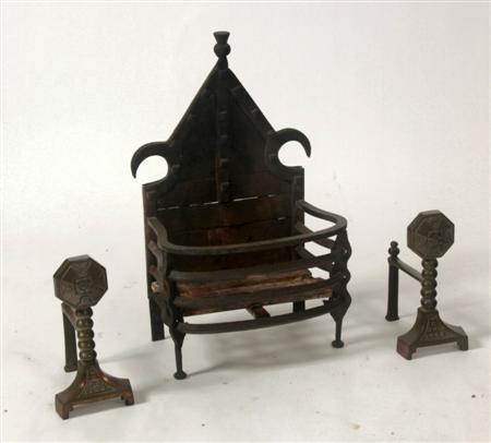 Appraisal: A pair of Gothic style brass fire dogs and basket