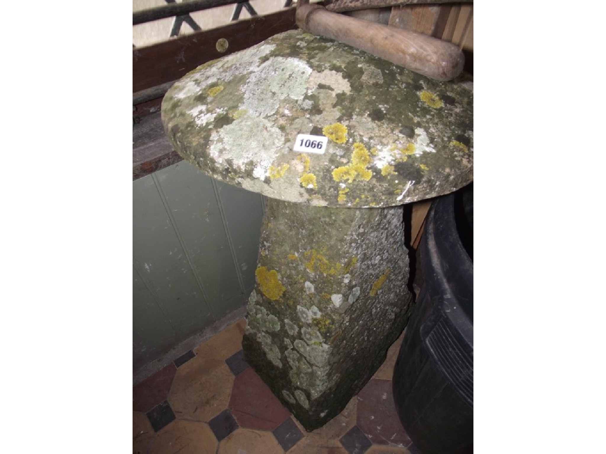 Appraisal: A weathered natural stone staddle stone with domed cap