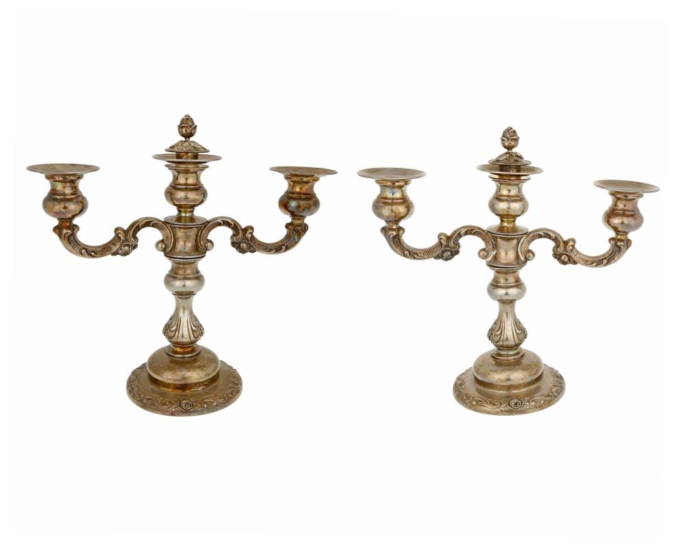 Appraisal: A pair of sterling silver weighted candelabra Mid- th century