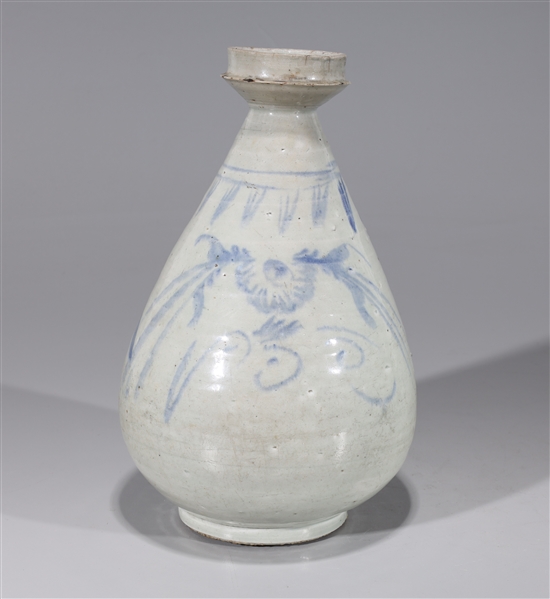 Appraisal: Korean blue and white porcelain vase with floral designs firing