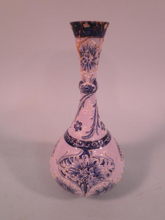 Appraisal: A William Moorcroft Florian ware bottle vase with typical tube