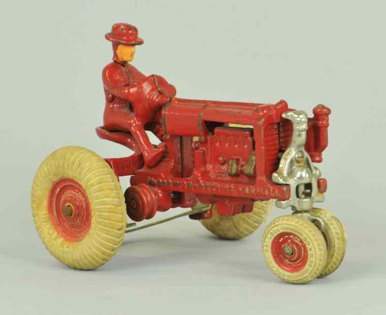 Appraisal: McCORMICK DEERING TRACTOR Arcade red painted cast iron Farmall tractor