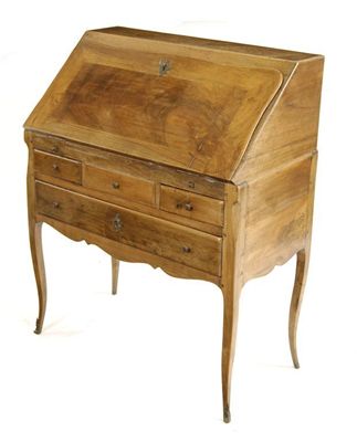 Appraisal: A French walnut bureau de dame the stepped interior with