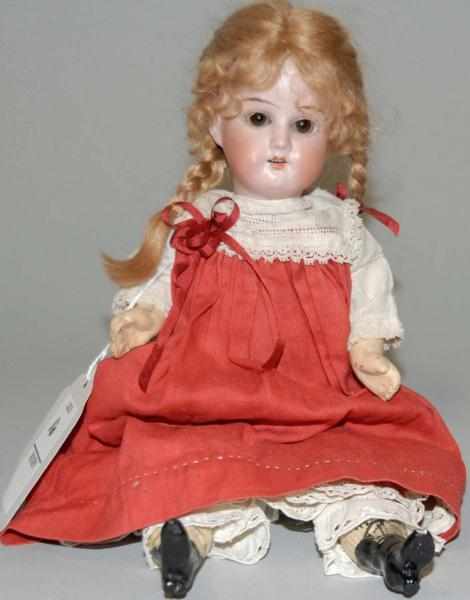 Appraisal: China Head Doll with Glass Eyes Composition arms and legs