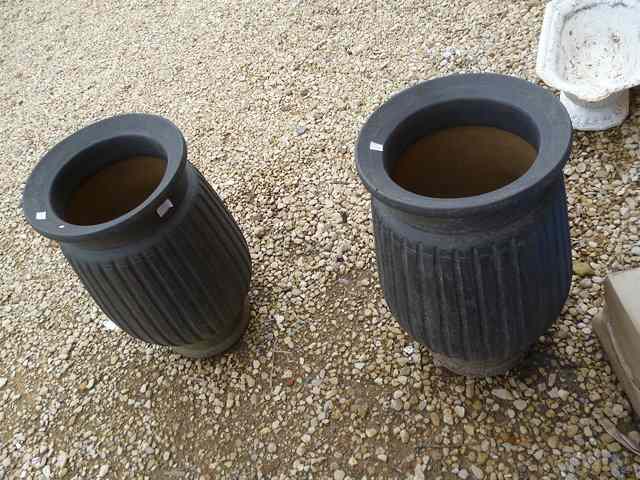 Appraisal: A PAIR OF BLACK GLAZED STONEWARE CYLINDRICAL GARDEN PLANTERS with