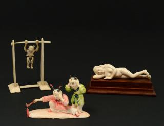 Appraisal: THREE ASSORTED IVORY CARVINGS Comprising polychromed group lighting a fire