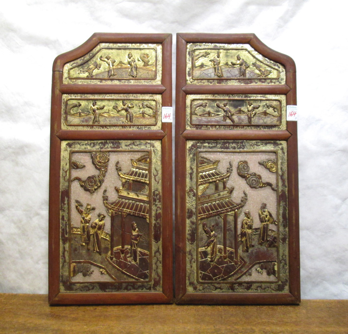 Appraisal: A PAIR OF CARVED AND PARCEL-GILT WOOD PANELS Chinese late