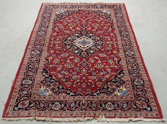 Appraisal: - Kashan center hall oriental carpet with a red field