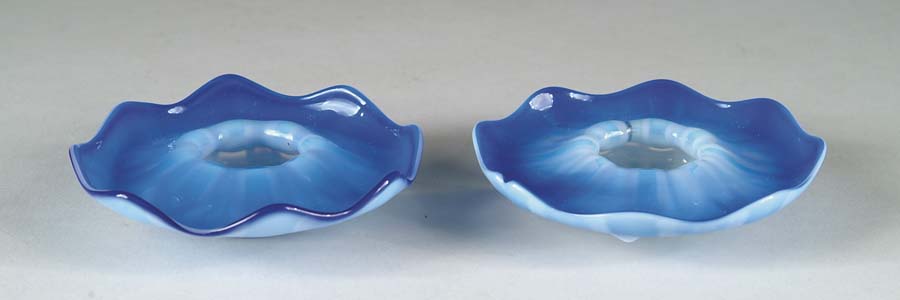 Appraisal: RARE TIFFANY CANDLE HOLDERS Brilliant blue pastel glass highlights this