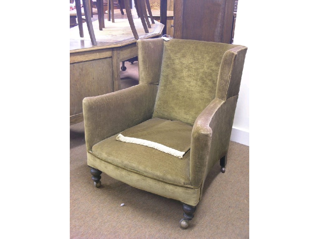 Appraisal: A Victorian mahogany armchair upholstered in an olive dralon on