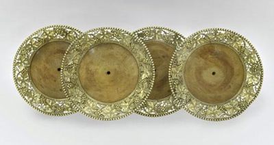 Appraisal: A set of four George III silver-gilt wine coasters circular