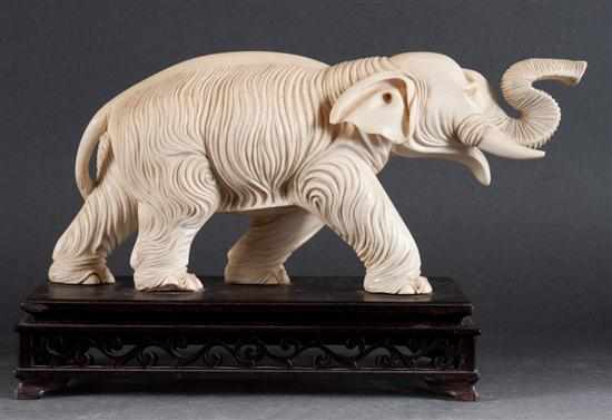 Appraisal: Chinese carved ivory figure of an elephant mounted on a