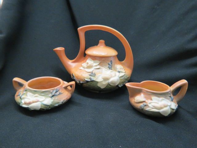 Appraisal: Roseville Pottery Magnolia Tea Set brown pot 's excellent