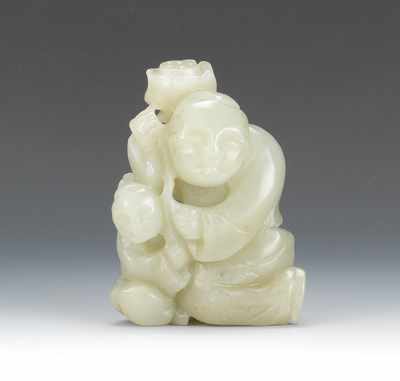 Appraisal: A Carved Jade Man with Child and Lotus Nicely carved