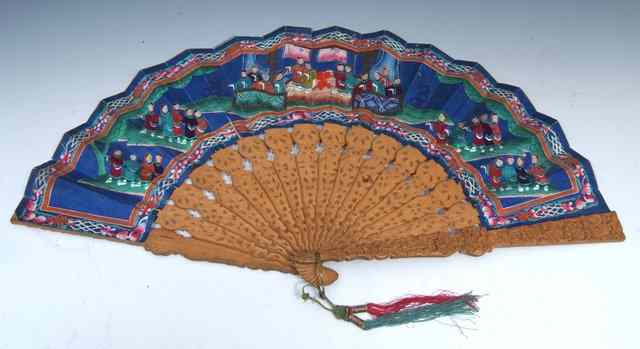 Appraisal: A CHINESE HARDWOOD FAN the paper guard painted with figures