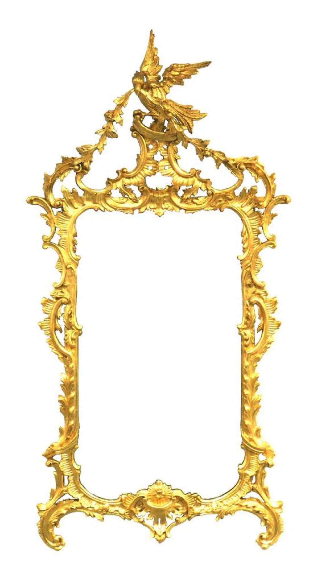 Appraisal: Rococo style gilded wall mirror ornately molded and pierced frame