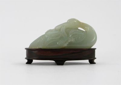 Appraisal: A Chinese pale celadon jade carving of a crane its