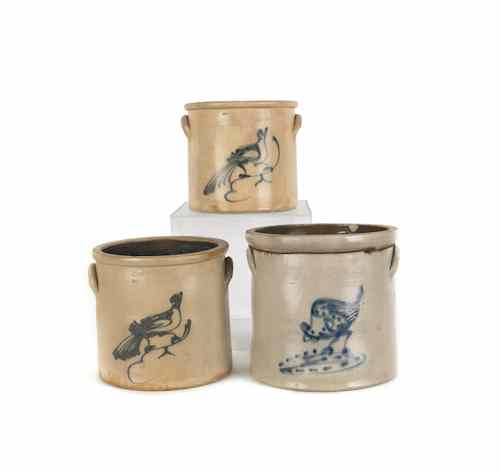 Appraisal: Three stoneware crocks th c with cobalt bird and pecking