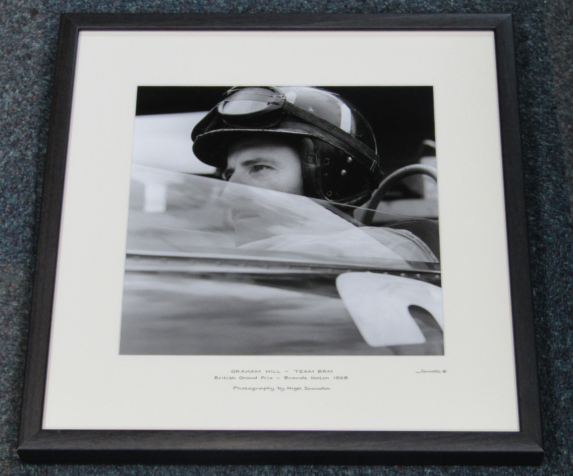 Appraisal: A Jarrotts motoring print of Graham Hill - Team BRM