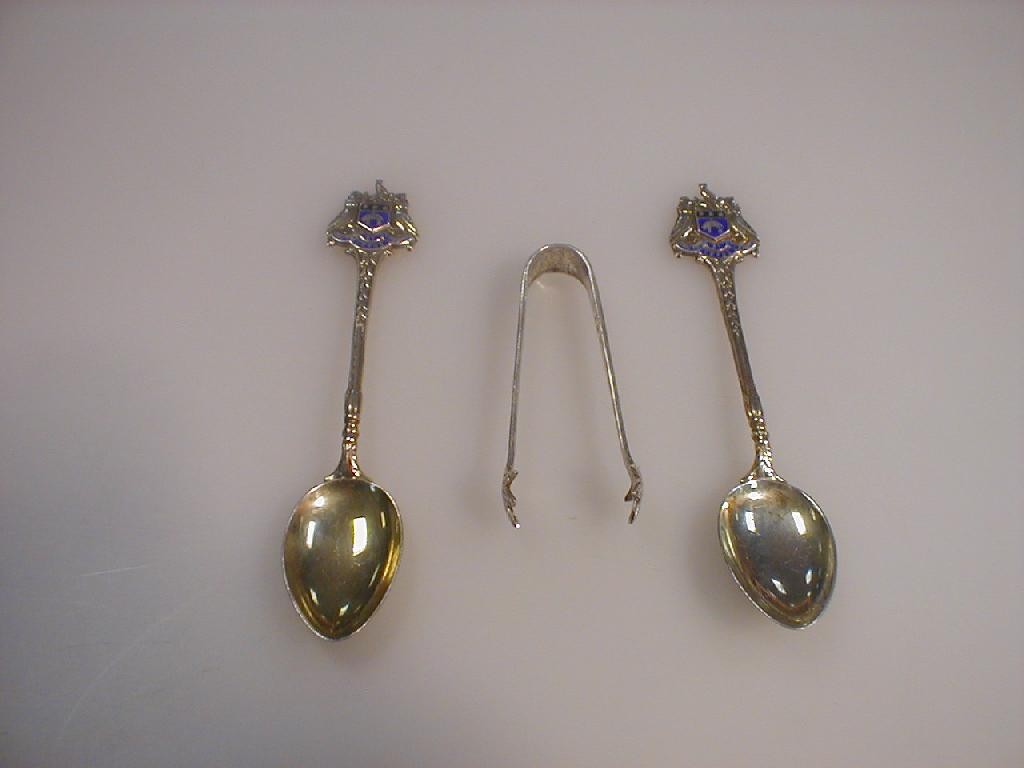 Appraisal: Two crested silver spoons and silver sugar bows