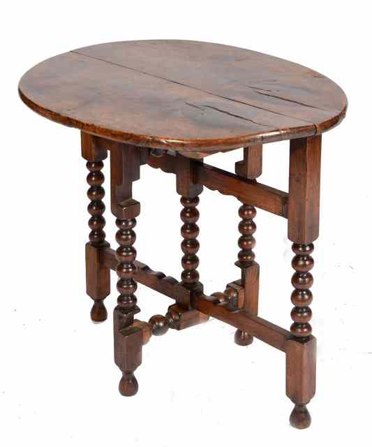 Appraisal: A TH CENTURY STYLE OVAL WALNUT COACHING TABLE the replaced