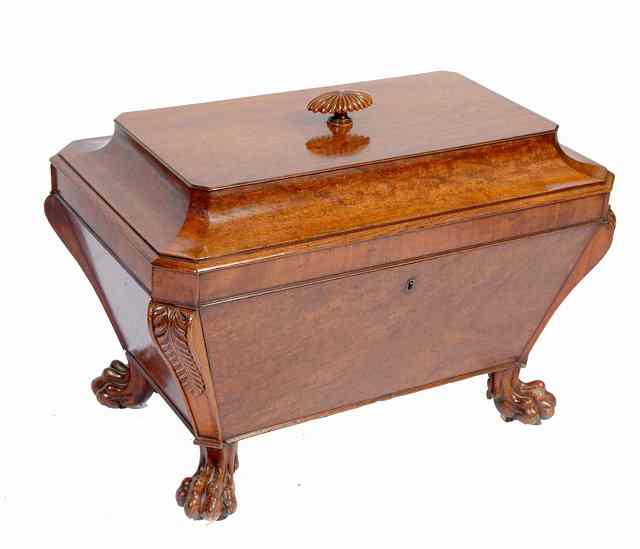 Appraisal: A REGENCY MAHOGANY CELLARETTE of sarcophagus form with carved finial