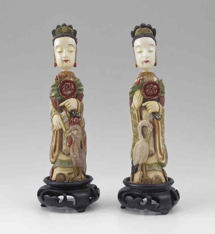 Appraisal: PAIR LARGE POLYCHROME CARVED IVORY SNUFF BOTTLES Larger than most