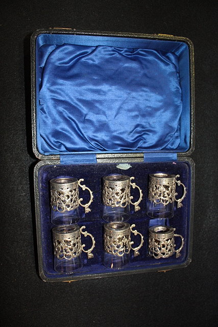 Appraisal: A SET OF SILVER COFFEE CAN HOLDERS with pierced and