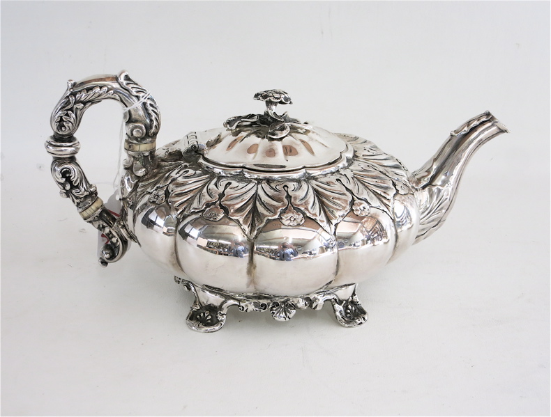 Appraisal: FOOTED SILVER TEAPOT attributed Continental fine silver with floral bouquet