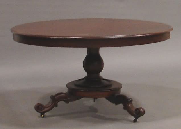 Appraisal: Massive circular tilt-top table on dividing vase-form pedestal on circular