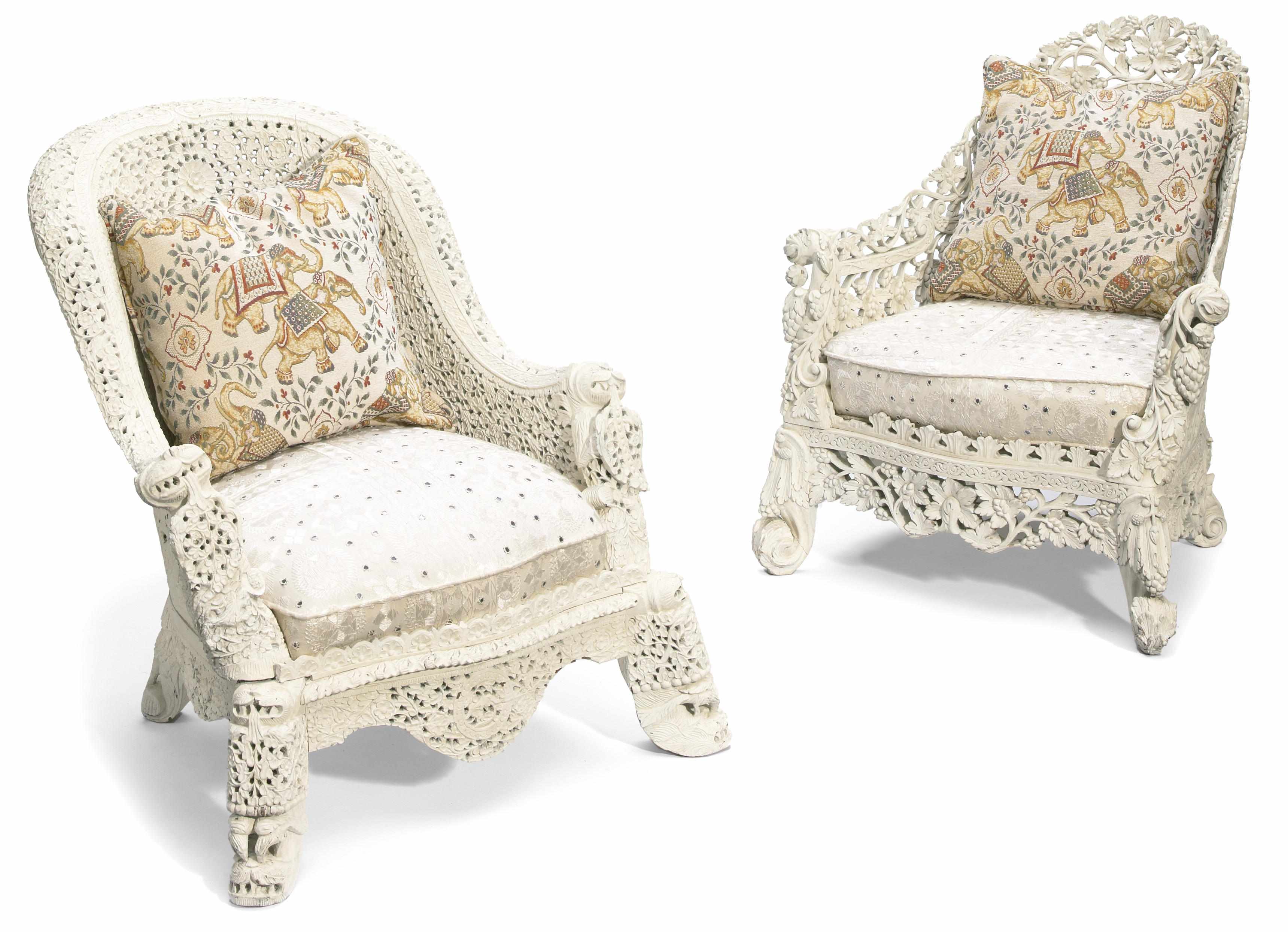 Appraisal: A pair of Anglo Indian pierced-carved wood armchairs the frames