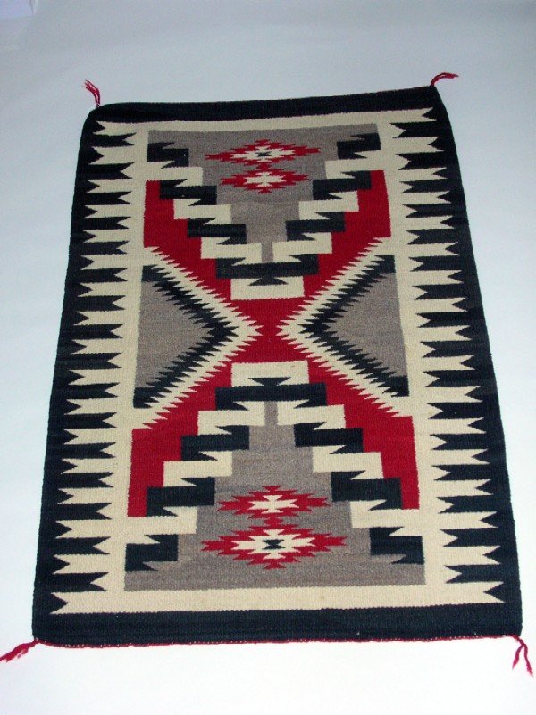 Appraisal: Navajo rug in black cream gray and red with central