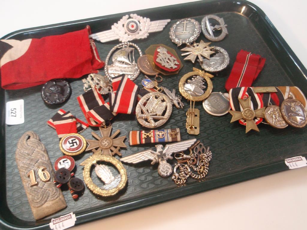 Appraisal: A collection of German Military cap badges and insignia