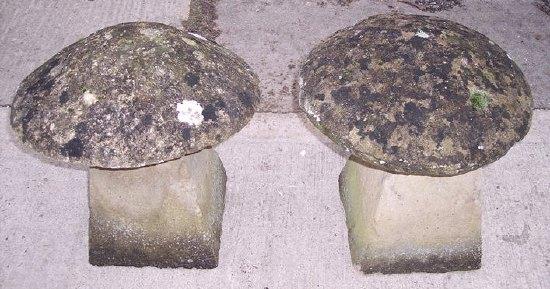 Appraisal: A pair of reconstituted stone staddle stones and tops cm