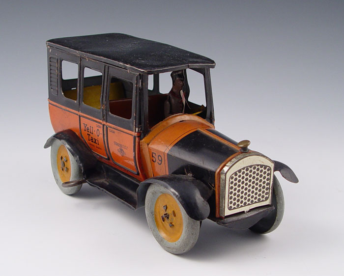 Appraisal: STRAUSS MECHANICAL TOYS YELL-O-TAXI Circa wind up Yell-O-Taxi Well marked