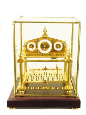 Appraisal: A gilt brass Congreve type rolling ball clock with a