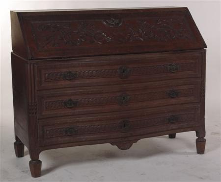 Appraisal: A th century French oak bureau the fall flap carved