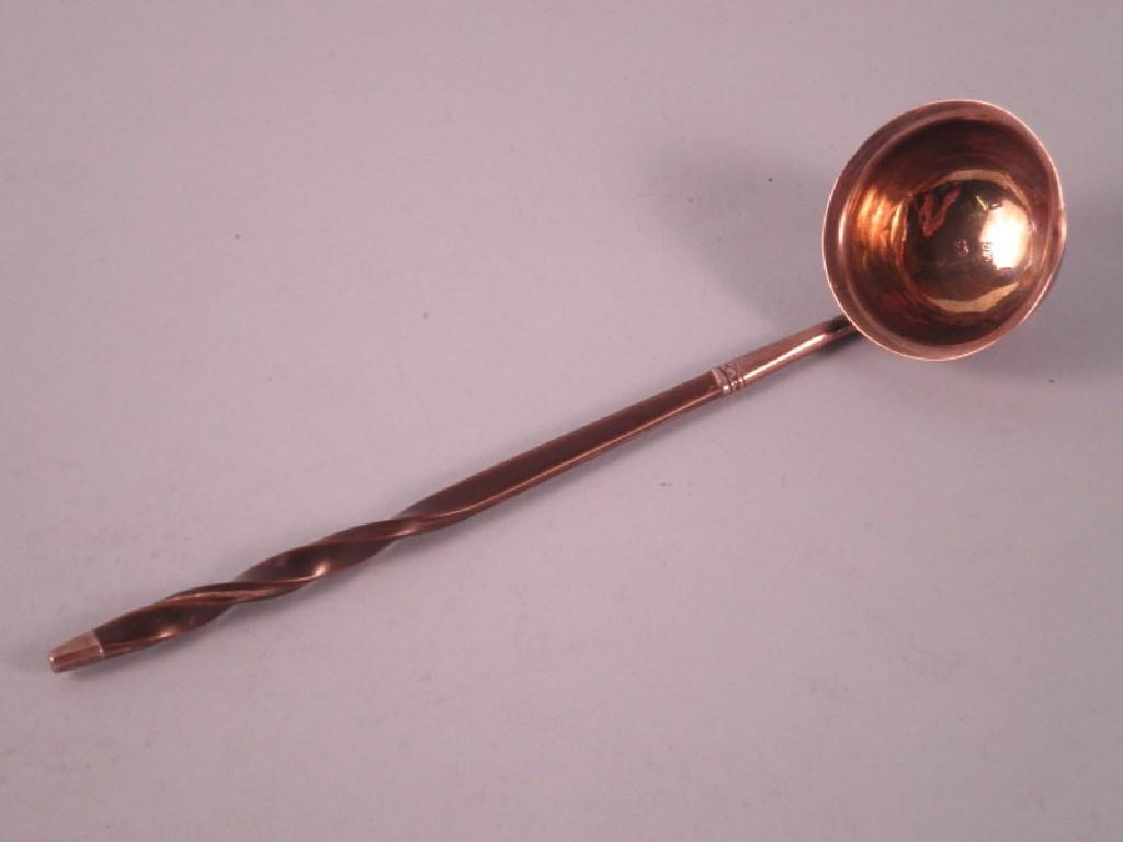 Appraisal: A small silver ladle with a twist whale bone handle