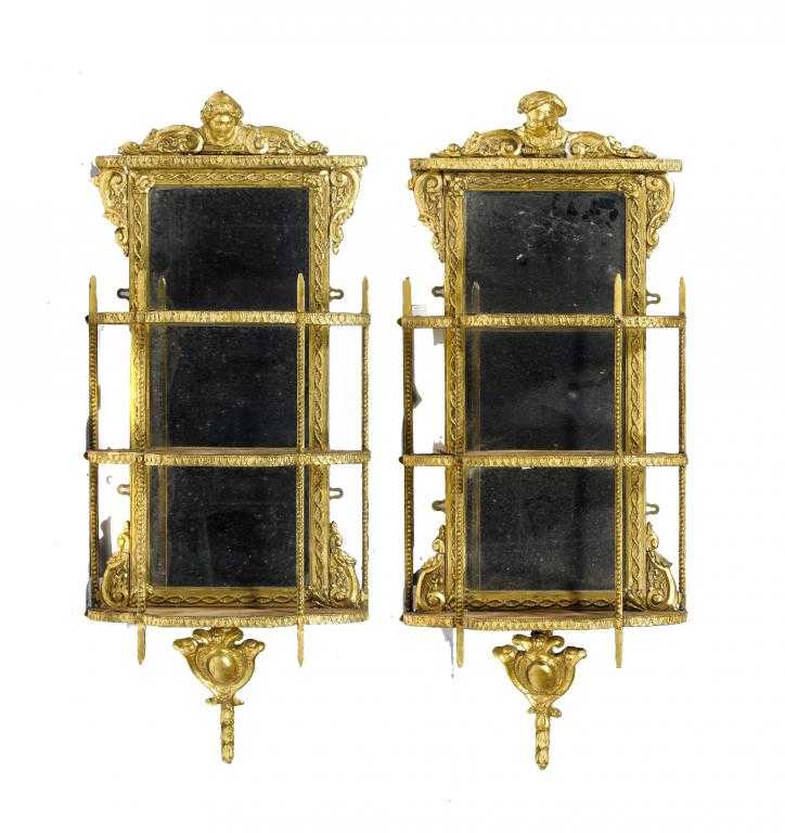 Appraisal: A PAIR OF GILTWOOD AND COMPOSITION MIRRORS crested by a