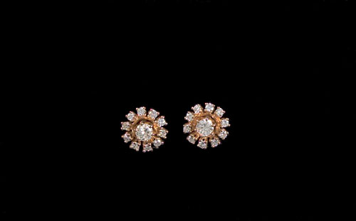 Appraisal: K yellow gold diamond earrings having center studs approx cts