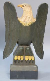 Appraisal: Large primitive carved and painted eagle perched on stand ht