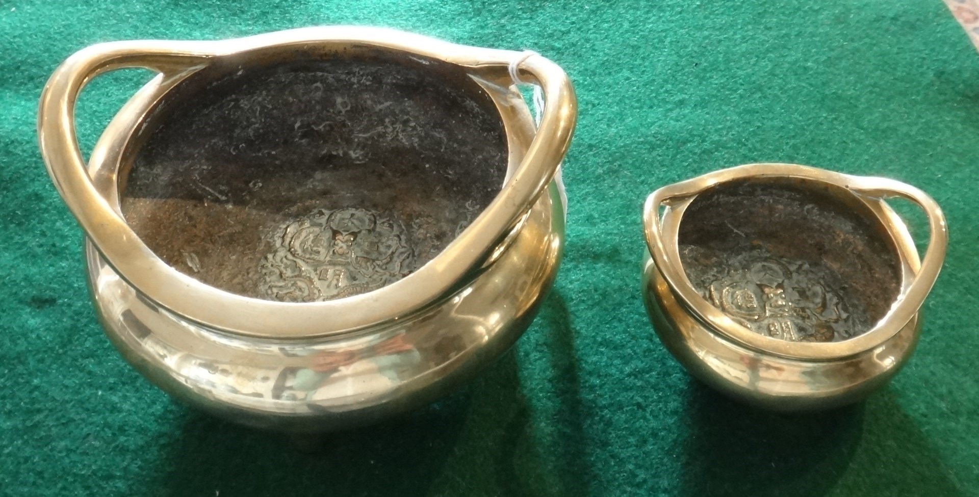 Appraisal: A Chinese polished bronze two-handled censer Xuande marks but later