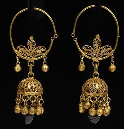 Appraisal: PAIR OF ISLAMIC GOLD FILIGREE EARRINGS WITH GARNET DROPS in