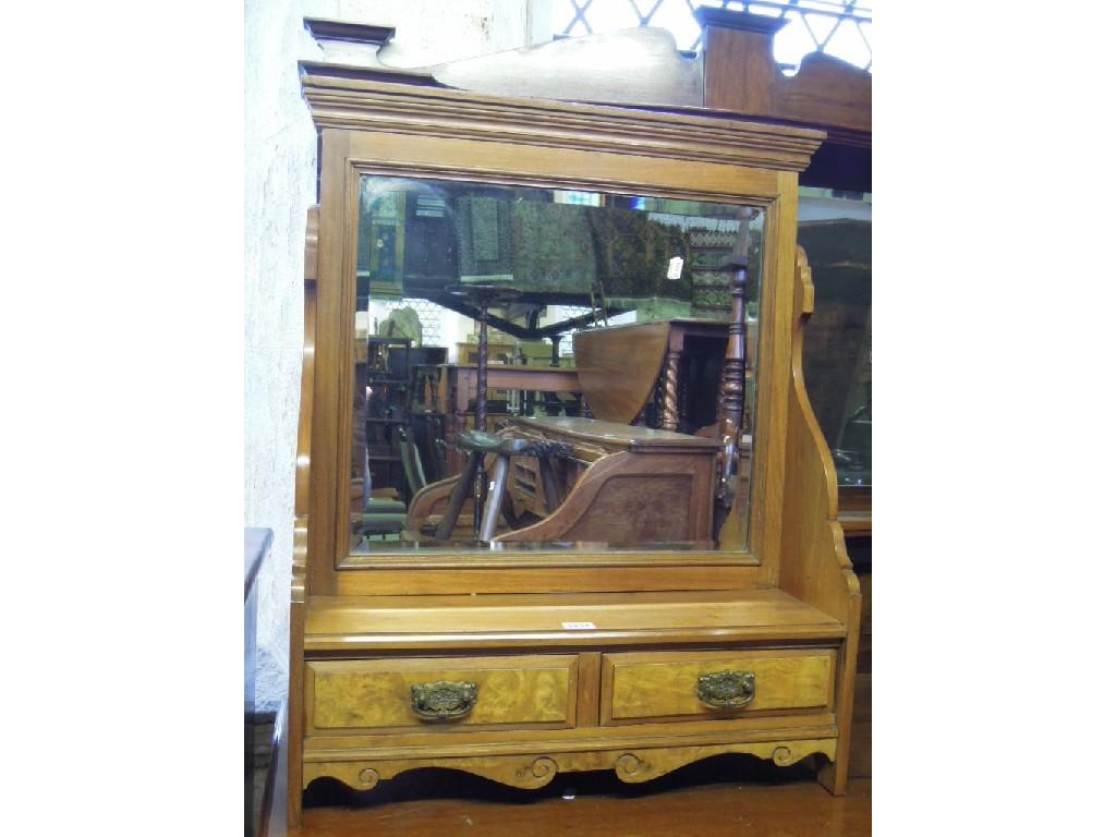 Appraisal: An Edwardian walnut dressing table mirror with rectangular bevelled edge