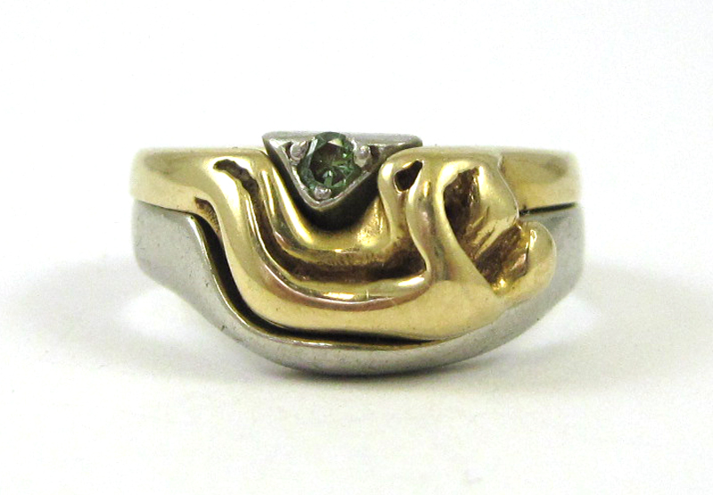 Appraisal: PLATINUM AND YELLOW GOLD DESIGNER RING with a platinum ring