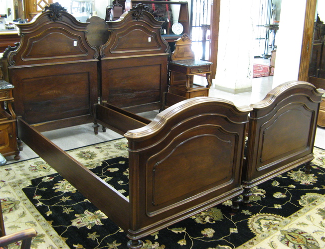 Appraisal: PAIR OF WALNUT TWIN BEDS WITH RAILS Louis XVI style