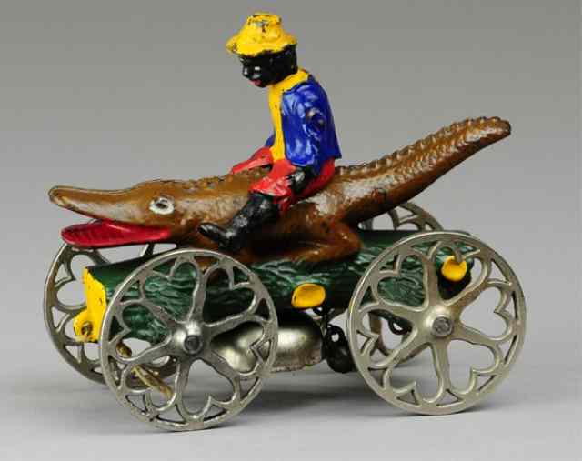 Appraisal: BOY RIDING ALLIGATOR BELL TOY N N Hill c very