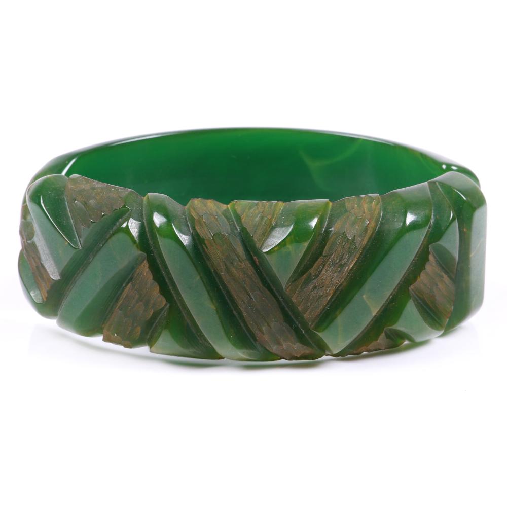 Appraisal: BAKELITE GREEN OVAL CLAMPER CUFF BRACELET WITH DEEPLY CARVED GEOMETRIC